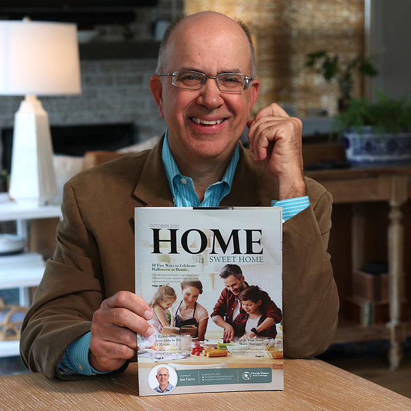 Jim Curry Holding a Home Sweet Home Magazine